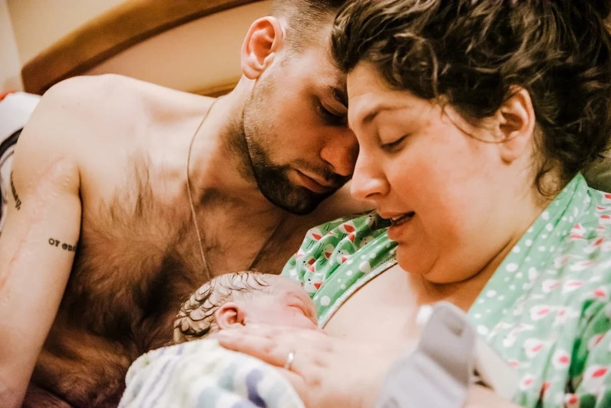 Baby girl resting peacefully against her mother