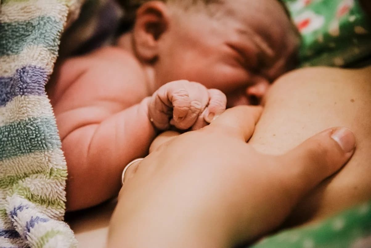 Tiny newborn features in soft natural light