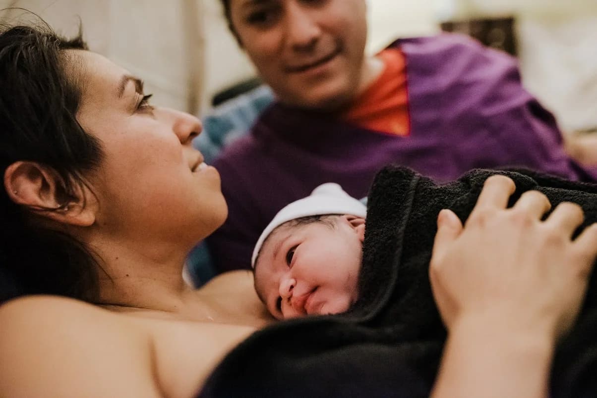 Mother whispering to her baby in the quiet aftermath