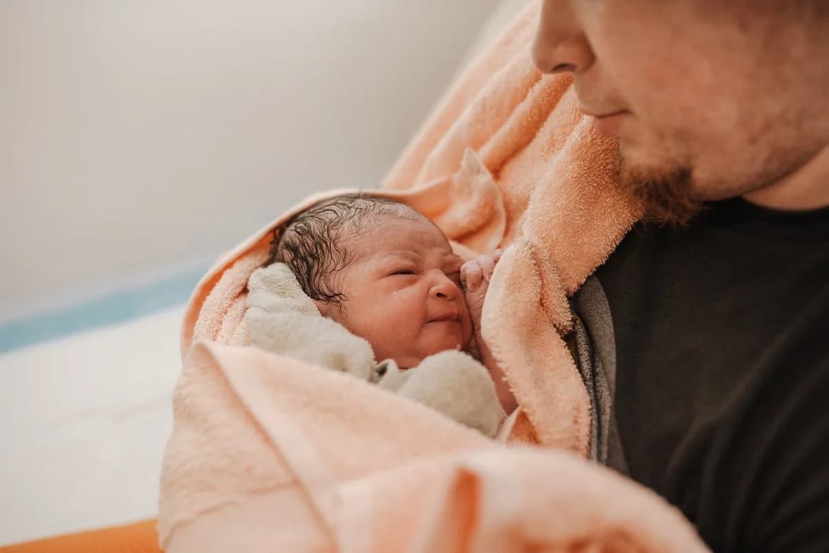 The birth team celebrating a beautiful home birth